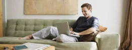 on-laptop-couch.webp
