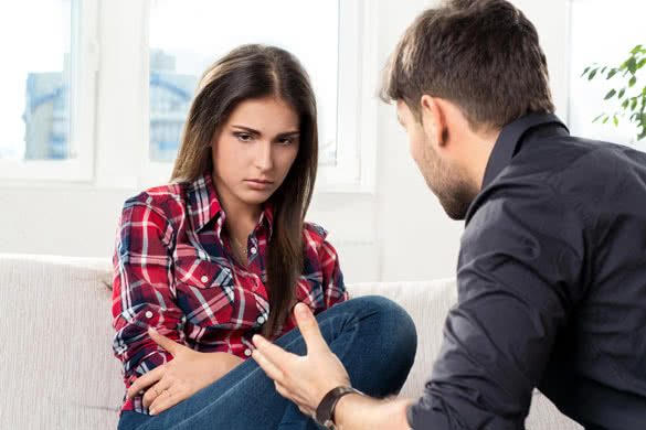 quarreled-young-couple-in-their-living-room.jpg